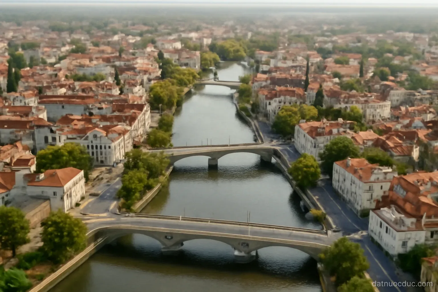 An aerial view of a mid-sized European city with rivers and bridges, no readable text
